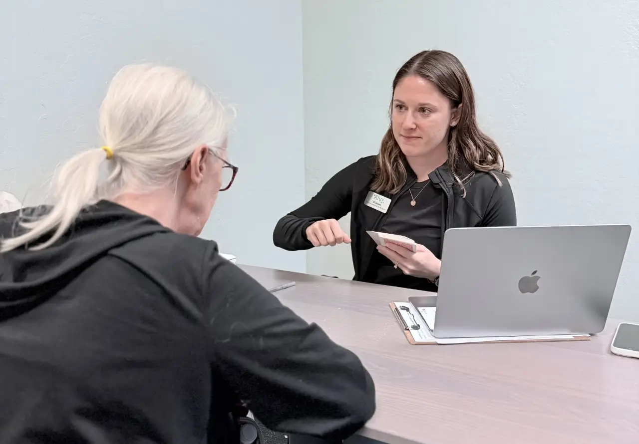 therapist from advanced neurological rehab in a session with her senior patient