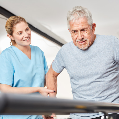 senior patient using balance bars to help recover from a stroke
