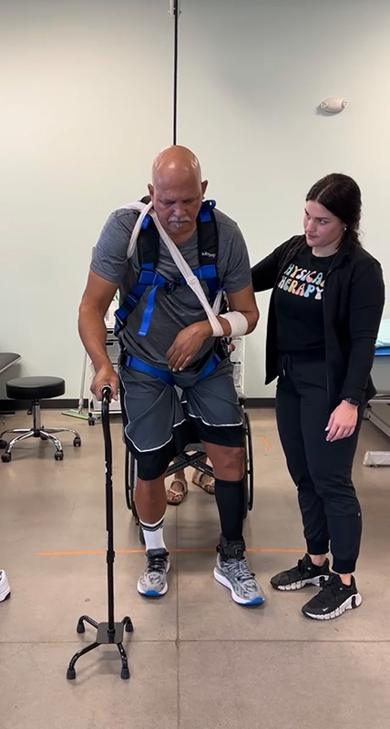 a patient doing a rehabilitation exercise after a spinal cord injury